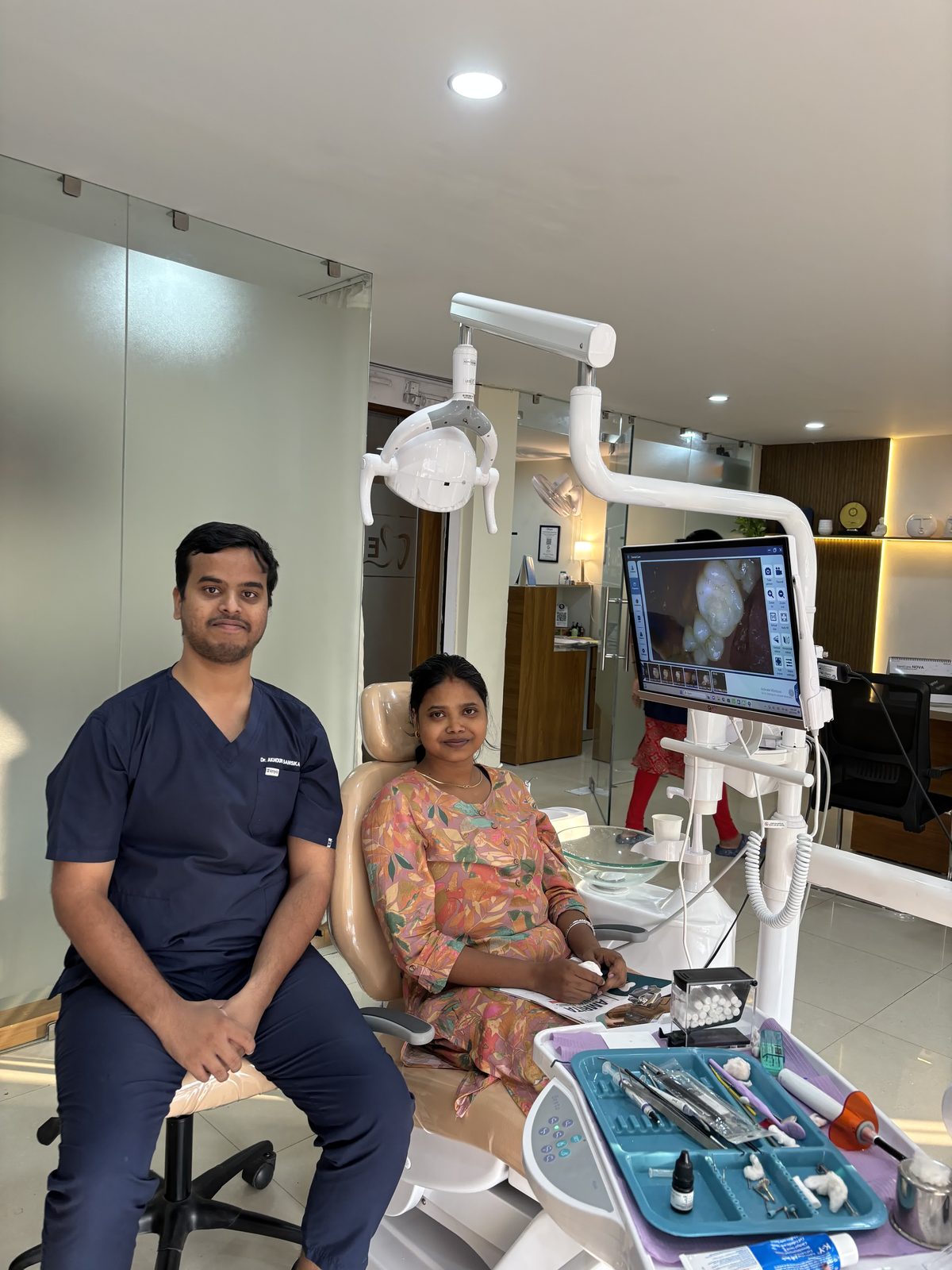 Dr. Akhouri Sanskar with a patient in the dental chair at Enamel Dental, Argora.