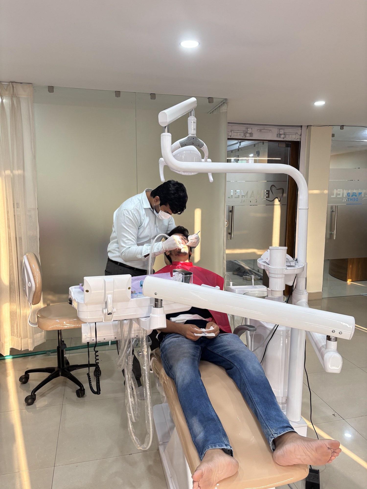 A patient in the dental chair at Enamel Dental, Argora Chowk.